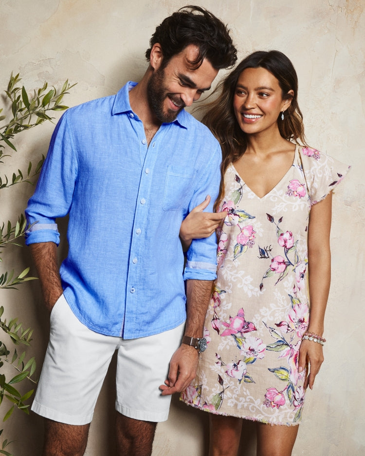 Man and woman standing close together against a neutral background