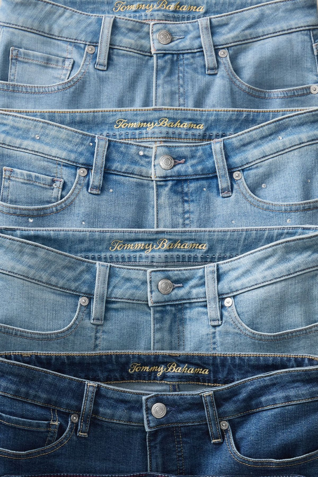Stack of blue jeans with Tommy Bahama branding.